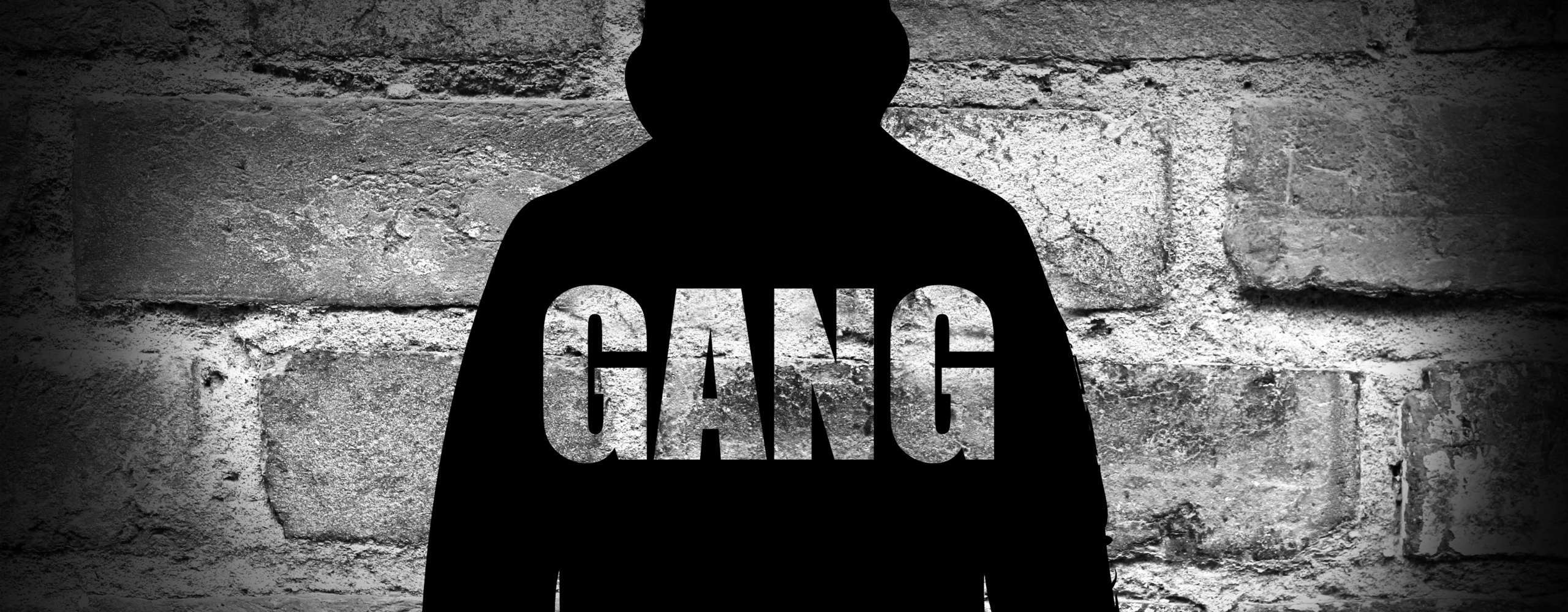 A hooded silhouette person with the word gang written across it for the Unlock drama blog HMP Leeds violence reduction project